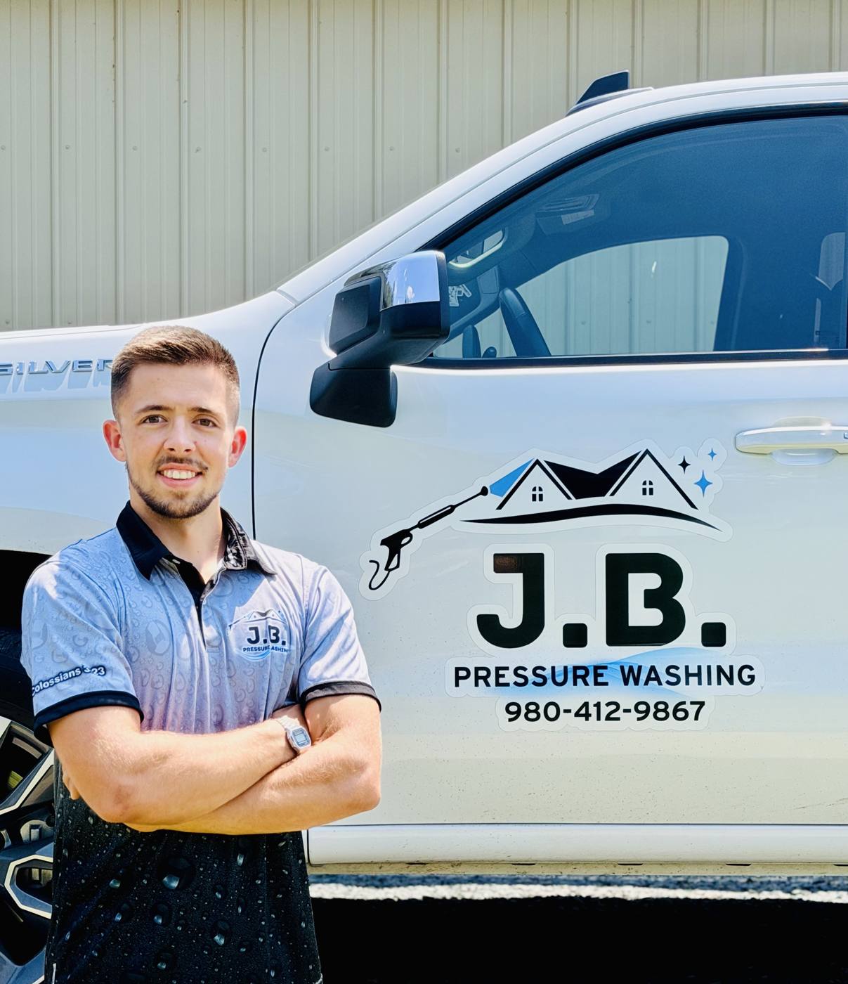 Justus Bansemer, owner of J.B. Pressure Washing, next to the company truck