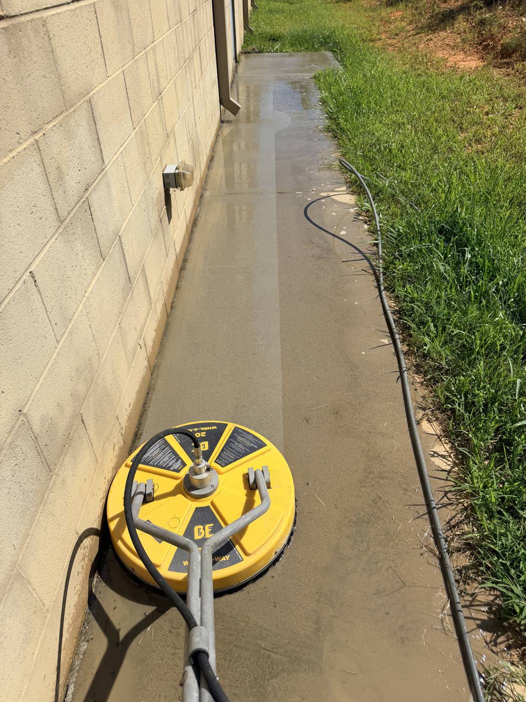 Freshly cleaned walkway next to a house