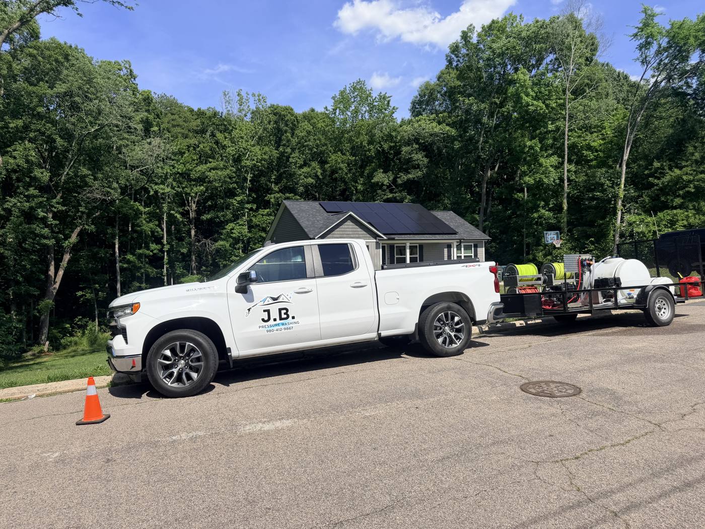 J.B. Pressure Washing truck and trailer rig on site